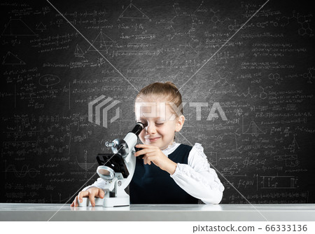 Little scientist looking through microscope Little scientist looking through microscope 66333136
