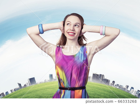 Redhead beautiful girl closing her ears with hands Redhead beautiful girl closing her ears with hands 66333268