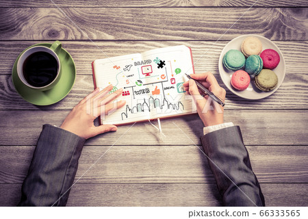 Businesswoman making business notes Businesswoman making business notes 66333565