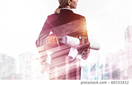 Woman architect with technical blueprints 66333832