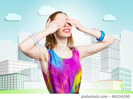 Redhead beautiful girl closing her eyes with hands 66334200