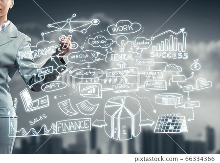 Woman sketching business ideas 66334366