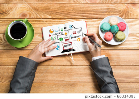 Businesswoman making business notes Businesswoman making business notes 66334395