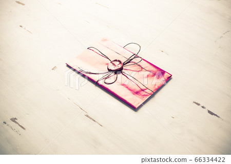 Letter with seal on table 66334422