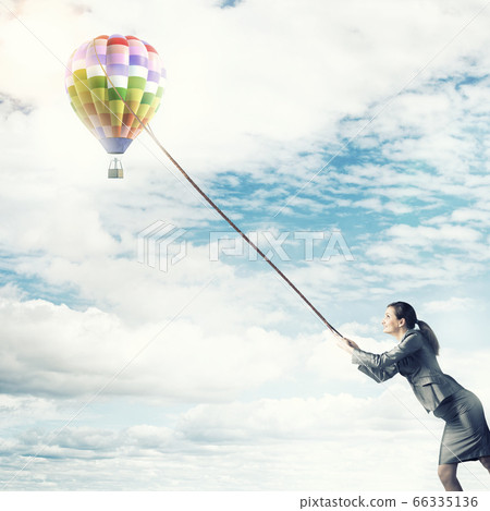 Woman catch balloon Woman catch balloon 66335136