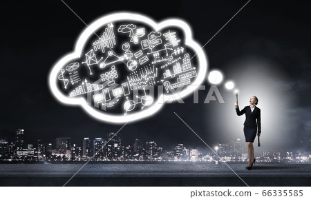 Woman throwing light on her ideas 66335585