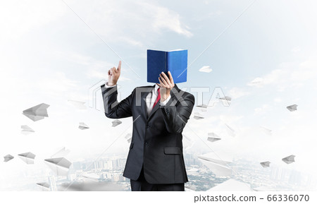 Businessman covered his face with organizer 66336070