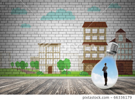 Businesswoman trapped in bulb Businesswoman trapped in bulb 66336179