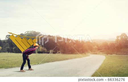 Engineer man carry progress graph Engineer man carry progress graph 66336276