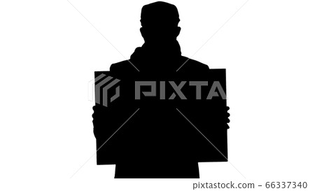 Silhouette Man in a trendy outfit and medical mask holding blank placard. Silhouette Man in a trendy outfit and medical mask holding blank placard. 66337340