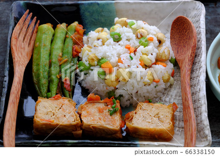 Vietnamese vegan food with fried rice and lotus seed, okra, tofu pie, simple vegetarian meal for non meat diet 66338150