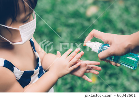 Mother take care son with face mask and sanitizer for protection disease flu or covid-19. 66348601