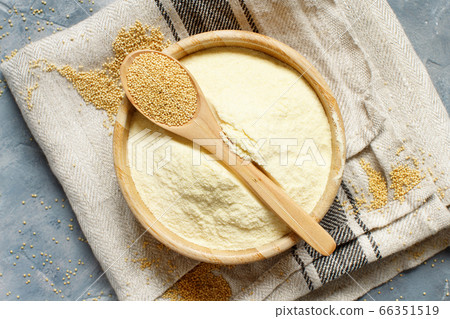 Bowl of raw Amaranth flour with a spoon of 66351519