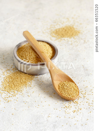 Bowl of raw Amaranth Grain with a spoon Bowl of raw Amaranth Grain with a spoon 66351520