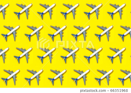 Pattern made of model airplane on yellow background. 66351968