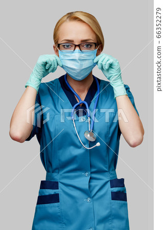 medical doctor nurse woman with stethoscope wearing protective mask and rubber or latex gloves 66352279