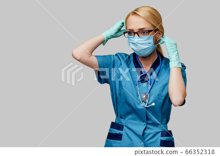 medical doctor nurse woman with stethoscope wearing protective mask and rubber or latex gloves medical doctor nurse woman with stethoscope wearing protective mask and rubber or latex gloves 66352318
