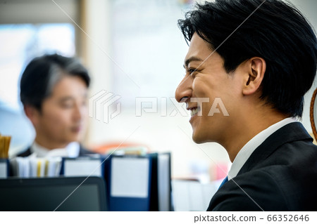 Profile young business man working at desk in office 66352646