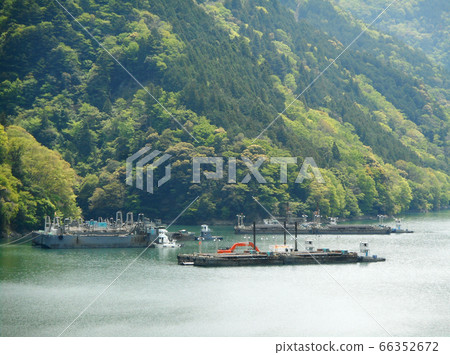 Work boat floating on the river Work boat floating on the river 66352672
