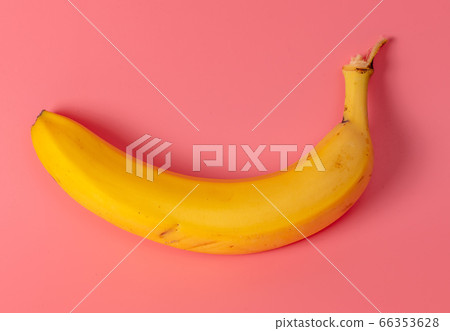 Banana is isolated on a pink background. 66353628