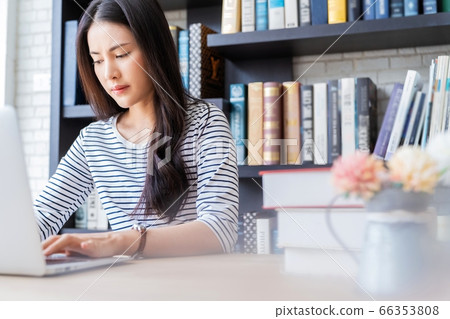 Young pretty woman library work memo smile book reading person material Young pretty woman library work memo smile book reading person material 66353808