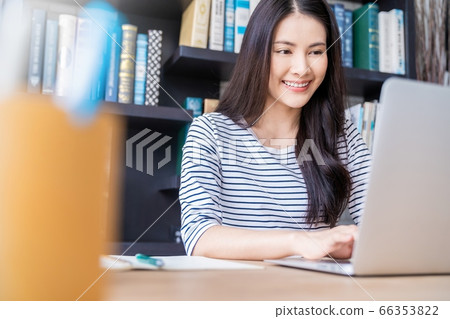 Young pretty woman library work memo smile book reading person material Young pretty woman library work memo smile book reading person material 66353822