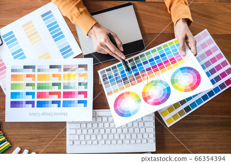 Image of female creative graphic designer working Image of female creative graphic designer working 66354394