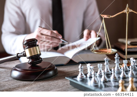 Judge gavel with scales of justice, male lawyers 66354411