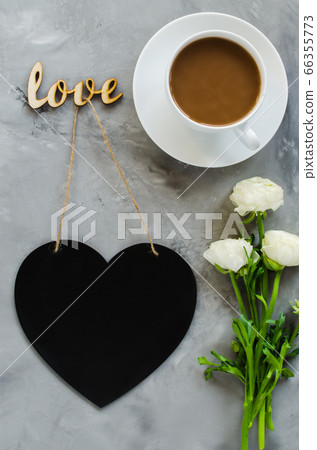 Mock up of greeting card. Empty chalk board heart shaped with coffee cup and flowers. Mock up of greeting card. Empty chalk board heart shaped with coffee cup and flowers. 66355773