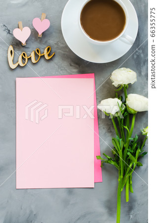 Mock up of greeting card. Empty pink paper with coffee cup and flowers. 66355775