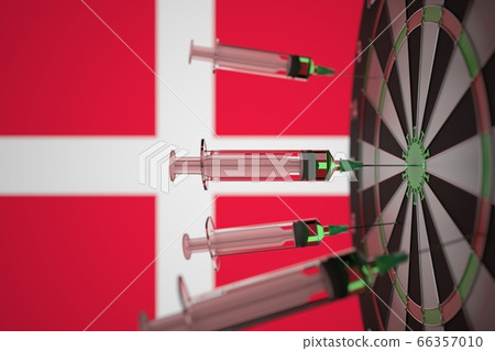 Coronavirus vaccine syringes on the Danish flag background. Medical research and vaccination in Denmark, 3D rendering Coronavirus vaccine syringes on the Danish flag background. Medical research and vaccination in Denmark, 3D rendering 66357010