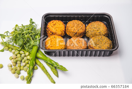 Baked salmon garnished with asparagus and tomatoes Baked salmon garnished with asparagus and tomatoes 66357184