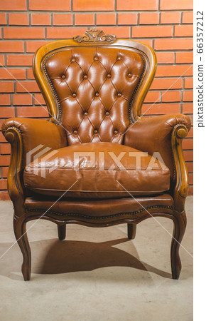 Antique armchair furniture with cushion against Antique armchair furniture with cushion against 66357212
