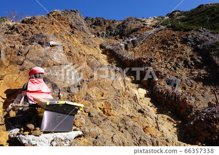 A mountain trail covered with rocks near the Jizo ridge of Yatsugatake that reminds you of the scenery of hell A mountain trail covered with rocks near the Jizo ridge of Yatsugatake that reminds you of the scenery of hell 66357338