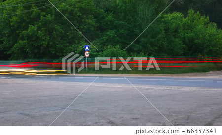 Blurred Glowing Lines of Headlights and Traffic Blurred Glowing Lines of Headlights and Traffic 66357341