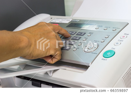 Men are using a fax machine in the office. business concept  66359897