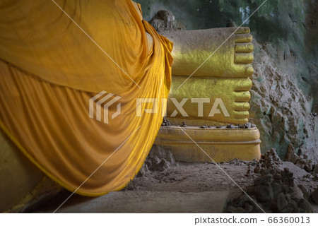 Feet of Reclining Buddha in Khan Kra Dai Cave in Prachuap Khiri Khan, Thailand. Feet of Reclining Buddha in Khan Kra Dai Cave in Prachuap Khiri Khan, Thailand. 66360013