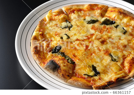 Freshly baked crispy dough Margherita (black background) 66361157