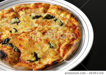 Freshly baked crispy dough Margherita (black background) 66361158