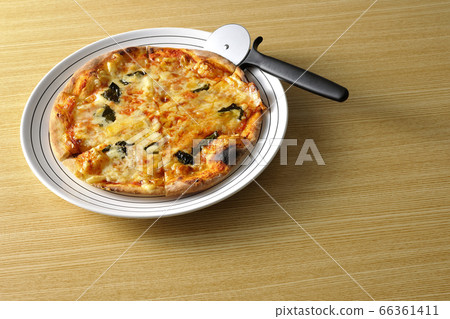 Freshly baked crispy dough Margherita and pizza cutter Freshly baked crispy dough Margherita and pizza cutter 66361411