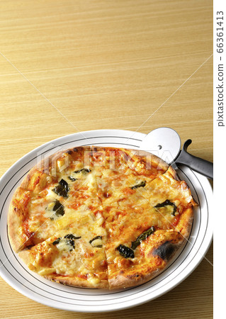 Freshly baked crispy dough Margherita and pizza cutter Freshly baked crispy dough Margherita and pizza cutter 66361413