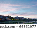 A vast evening sky and cityscape 66361977