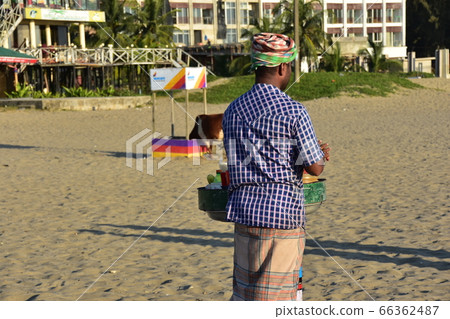 A Cox's Bazar beach resort in Bangladesh A man selling homemade snacks on the beach 66362487