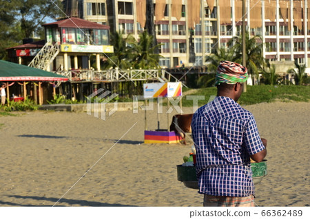 A Cox's Bazar beach resort in Bangladesh A man selling homemade snacks on the beach 66362489