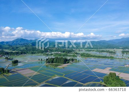 Aerial view of rural landscape after rice planting, June Akita Prefecture Aerial view of rural landscape after rice planting, June Akita Prefecture 66363718