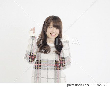 A woman gazing and smiling and staring A woman gazing and smiling and staring 66365125