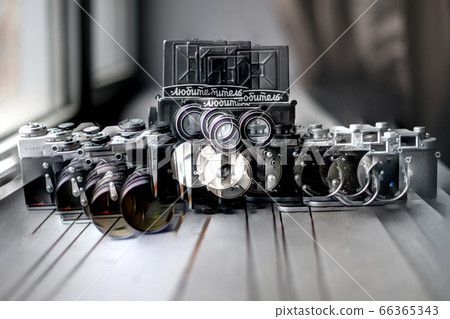 Double exposure Photography, three retro old film photo cameras on wood background, hipster Lifestyle Double exposure Photography, three retro old film photo cameras on wood background, hipster Lifestyle 66365343