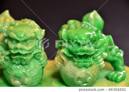 Shisa carved with rough jade stone Shisa carved with rough jade stone 66368892