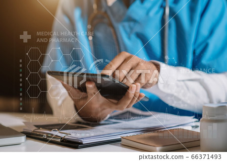 Medicine doctor hand working with modern digital tablet computer interface as medical network concept. 66371493