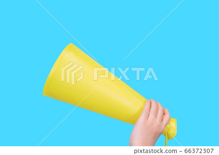 Yellow megaphone and child's hand Yellow megaphone and child's hand 66372307